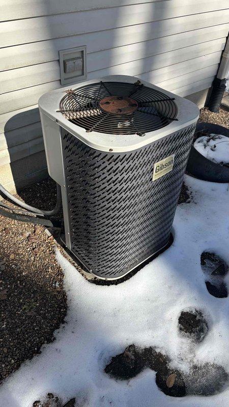 Conducted comprehensive replacement estimate for 20-year-old Gibson HVAC system in mobile home. Assessed existing outdoor unit showing signs of age and weathering, and inspected Honeywell thermostat currently maintaining interior temperature at 67°F. Customer specifically interested in replacement options with improved efficiency rather than repair alternatives, with no concerns about existing ductwork.