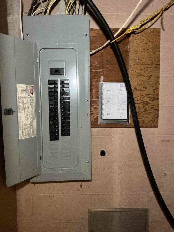 Completed follow-up visit to install 200A Generac automatic transfer switch for generator system. Mounted transfer switch on exterior brick wall adjacent to utility meter, connected necessary conduits and wiring. Integrated system with existing electrical panel in utility room, ensuring proper circuit connections for seamless power transfer capability.