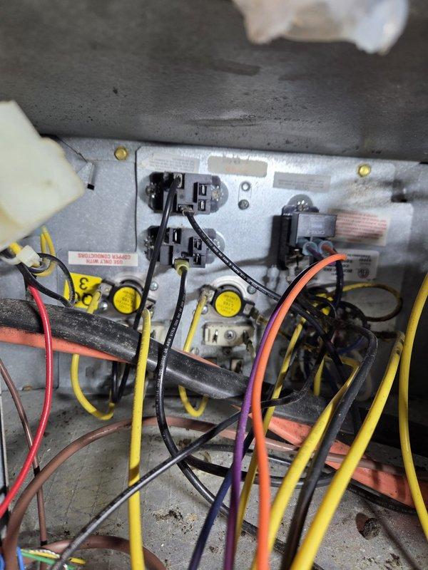 Diagnosed an 11-year-old HVAC system experiencing insufficient heating despite unit operation. Inspection of electrical control panel revealed faulty wiring connections at the relay terminals. Repaired damaged connections and verified proper system function, restoring normal heating operation. System now maintaining desired temperature without reliance on secondary wood-burning heat source.