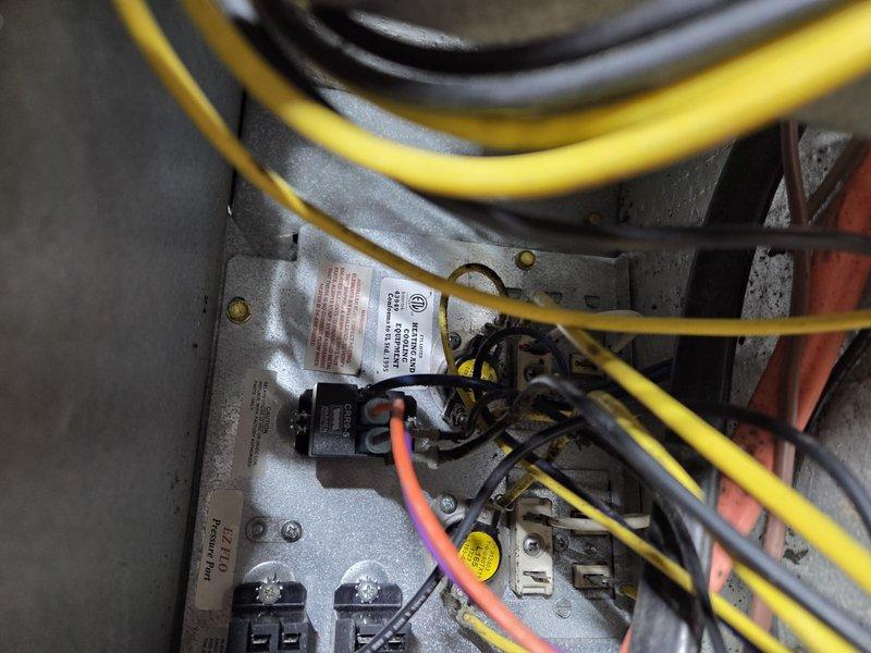 Diagnosed an 11-year-old HVAC system experiencing insufficient heating despite unit operation. Inspection of electrical control panel revealed faulty wiring connections at the relay terminals. Repaired damaged connections and verified proper system function, restoring normal heating operation. System now maintaining desired temperature without reliance on secondary wood-burning heat source.