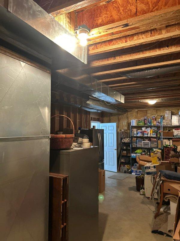 Conducted site assessment for generator installation at residential property with dual electrical panels mounted on exposed wooden studs in basement area. Client requires propane-fueled generator with new tank installation (existing tank located at north end of home). Noted 4-wheel drive vehicle access will be needed for installation. Client will be present during follow-up consultation.