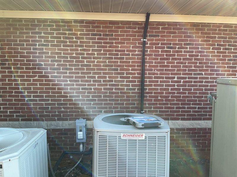 Conducted comprehensive assessment of two aging outdoor HVAC units mounted on concrete base adjacent to brick exterior wall. Units showed signs of deterioration requiring replacement, with visible Schneider-branded system and secondary white unit both evaluated. Documented electrical connections including disconnect boxes and conduit configuration for proper replacement planning. Customer (Tonya) confirmed non-operational system status and expressed interest in replacement options only, not repairs.
