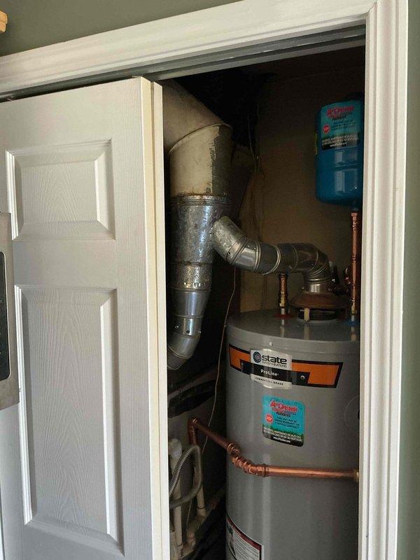 Successfully installed a State ProLine 40-gallon gas water heater (57 1/2" height, 21" width) with copper piping connections in utility closet. Installation included proper venting with galvanized steel ductwork and mounting of expansion tank. Unit comes with manufacturer warranty of 6 years on parts and 1 year on labor.