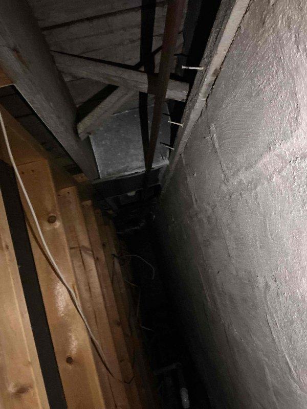 Performed comprehensive inspection of customer's plumbing system to address concerns about water pressure issues and potential water heater replacement. Examined exposed plumbing lines in unfinished basement/crawlspace, noting conditions of copper and PVC piping. Provided customer with water heater replacement options based on assessment findings.