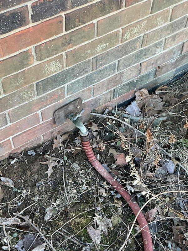 Conducted a site assessment of outdoor water supply connection to barn bathroom, documenting deteriorated cast iron piping requiring replacement. Evaluation included inspection of exterior wall-mounted spigot with visible weathering and mineral deposits. Customer has requested prompt scheduling to proceed with our services rather than alternative provider.