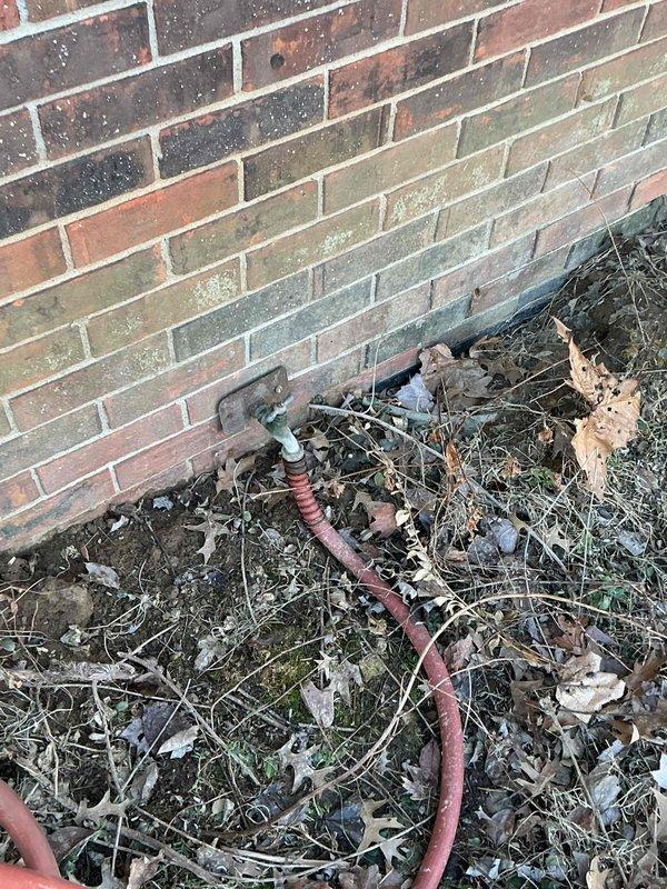 Conducted a site assessment of outdoor water supply connection to barn bathroom, documenting deteriorated cast iron piping requiring replacement. Evaluation included inspection of exterior wall-mounted spigot with visible weathering and mineral deposits. Customer has requested prompt scheduling to proceed with our services rather than alternative provider.