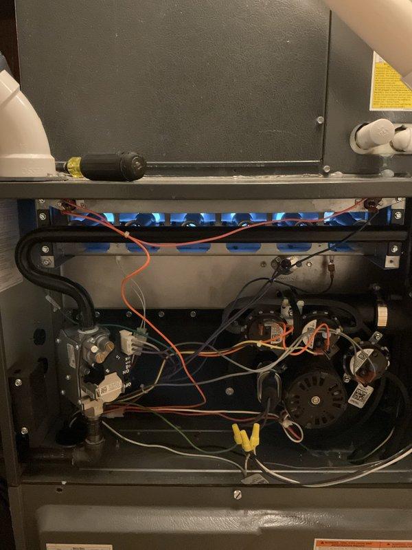 Responded to no heat call for 6-year-old system with no airflow from vents. Diagnosed issue with thermostat communication and verified furnace operation by accessing control panel, where blue flames were observed indicating proper gas ignition. Restored heating functionality and confirmed system operation before completing service.