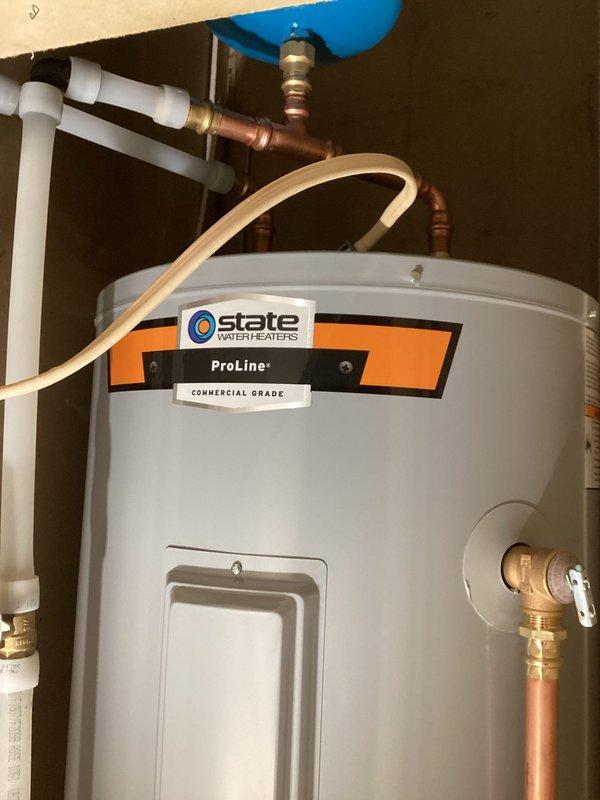 Successfully installed a 40-gallon gas short water heater (48" height, 22" width) with a 6-year parts and 1-year labor warranty. Completed all necessary plumbing connections including copper piping, PVC venting, and installed an expansion tank. The State ProLine Commercial Grade unit was properly secured in the utility enclosure with all connections tested for proper function.