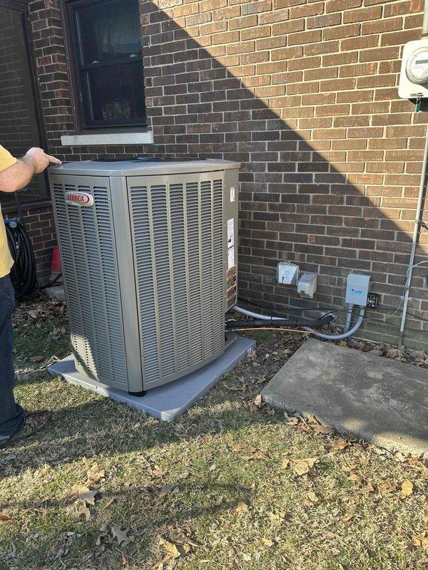 Successfully installed a complete Green2T 18/99 Lennox HVAC system at the Mt Vernon location, including indoor furnace with PVC ventilation and outdoor condensing unit positioned on concrete pad. System was properly connected to existing electrical service and photographed for documentation purposes.
