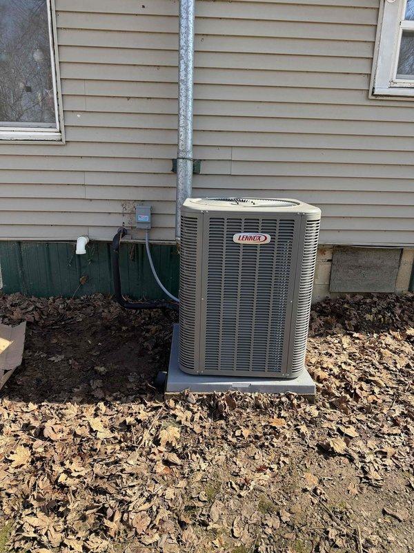 Performed follow-up service visit to complete previously unfinished A/C installation work. Successfully installed and set up Lennox residential HVAC system including indoor furnace unit with PVC ventilation components in utility area and outdoor condensing unit positioned on concrete pad with proper electrical connections. All components properly installed with refrigerant lines connected, system tested, and A/C now operational.