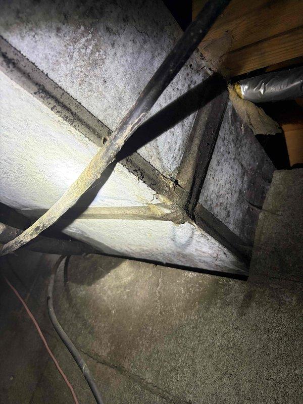 Responded to service call for thermostat issues where system would not shut off. Upon inspection of the ductwork and structural components in the crawlspace, identified loose connections in the metal ductwork junction points which were affecting system operation. Sealed connection points with metal tape and verified proper system cycling after repair.