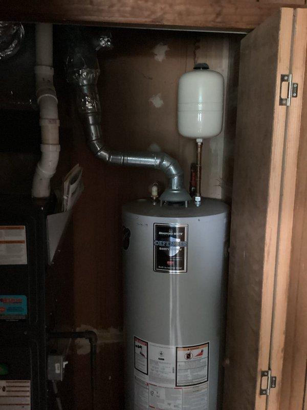 Diagnosed and repaired water heater system that was failing to provide adequate hot water throughout residence. Discovered significant sediment buildup in tank and malfunctioning dip tube, which were preventing proper heating and distribution. Performed complete flush of system, replaced dip tube and expansion tank, and verified proper operation with consistent hot water delivery to all fixtures.