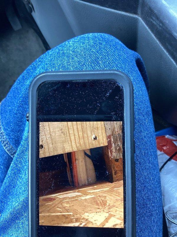 Conducted follow-up inspection of mini split line cover for potential damage as previously reported. Documented condition with photos of wooden structural elements surrounding the installation area, including exposed framing and ductwork. No visible damage was observed to the line cover during inspection.