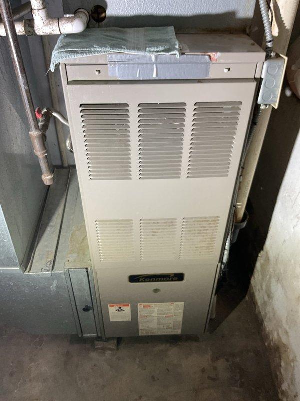 Performed annual Gold Level maintenance on 20-year-old Kenmore HVAC system. Inspected electrical connections and wiring (red, green, black, yellow, orange, and purple) for proper functionality. Replaced 16x24x1 filter and verified system operation; unit is functioning adequately despite age.