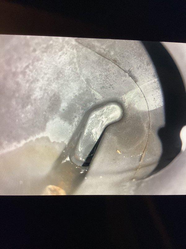 Performed scheduled Gold Level maintenance on 6-year-old HVAC system (second visit). Inspected evaporator coil which showed signs of condensation accumulation, and examined motor assembly with cooling fins. Replaced 20x25x5 home filter and documented component conditions with photos for service record.