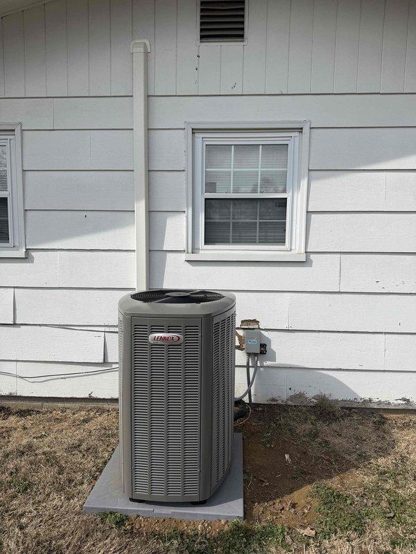 Successfully installed a complete Lennox HVAC system including outdoor AC unit mounted on concrete pad with proper PVC exhaust piping and electrical connections. Interior components include new Lennox furnace and associated ductwork installed in utility closet alongside existing water heater, with all systems tested and functioning properly.
