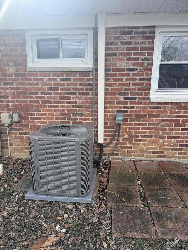 Successfully installed a complete Lennox HVAC system with outdoor condenser unit mounted on concrete pad against brick exterior wall, including proper electrical connections and refrigerant lines. Indoor air handler was installed in utility room alongside existing State water heater, with all necessary ductwork, PVC venting, and electrical components properly connected. System was tested and verified to be functioning according to manufacturer specifications.