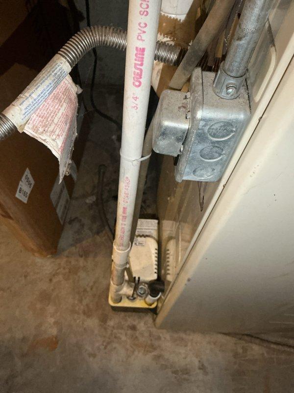 Completed annual maintenance service on a 27-year-old residential HVAC system as part of Gold Level maintenance plan. Inspected the basement-located air handler with attached galvanized sheet metal ductwork and evaluated PVC drain line connections. System showed normal signs of age but is functioning properly with no immediate concerns identified.