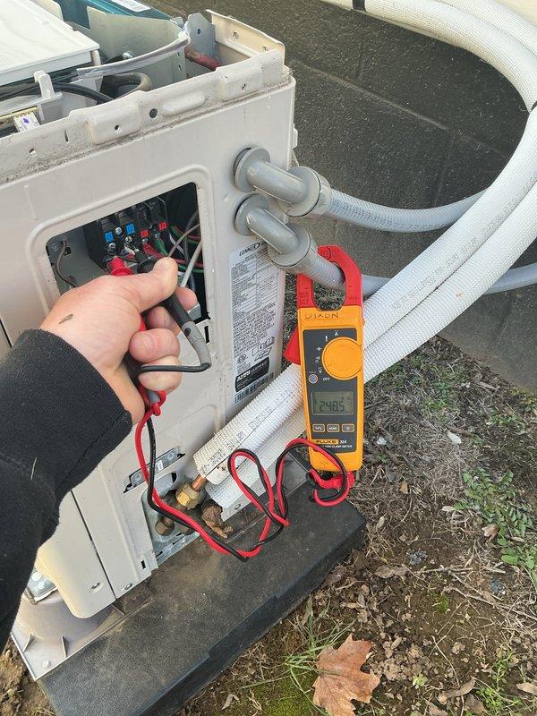 Completed annual Gold Level maintenance on 5-month-old HVAC system. Performed comprehensive electrical diagnostics using digital multimeter, confirming proper voltage readings (24.85V and 24.66V) at control terminals. Inspected and verified integrity of all electrical connections, wiring, and refrigerant lines.