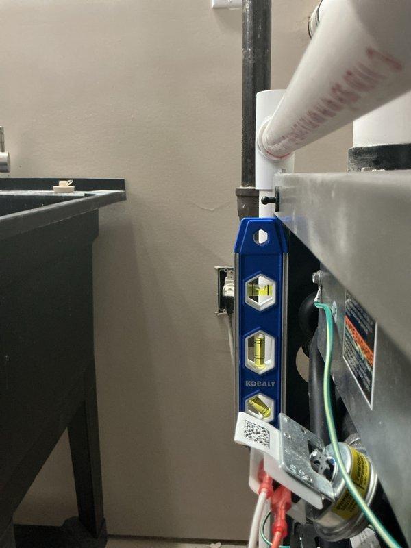 Performed annual planned maintenance on HVAC system (installed 8/20/25). Inspected control board circuitry and verified proper electrical connections with no visible damage or deterioration. Checked system leveling using Kobalt level tool and examined PVC condensate lines for proper drainage. All components functioning normally; no replacement needed for 16x25x5 filters at this time. Documentation completed with supporting photos of control system and plumbing components.