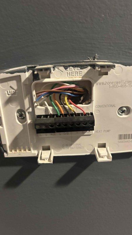 Conducted comprehensive HVAC replacement consultation for 18-year-old system. Inspected existing Honeywell thermostat wiring configuration and outdoor AC unit, which shows typical age-related wear. Customer is evaluating competitive quotes for system replacement and seeking more cost-effective options.