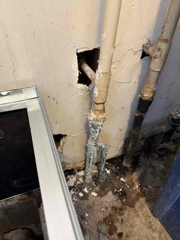 Successfully replaced corroded metal pipes with new PVC plumbing connections and installed a complete 2.5-ton 15.5 SEER 96% efficiency Lennox HVAC system. System was properly integrated with the existing water heater in the utility closet, with all necessary ductwork and drainage components installed according to manufacturer specifications.