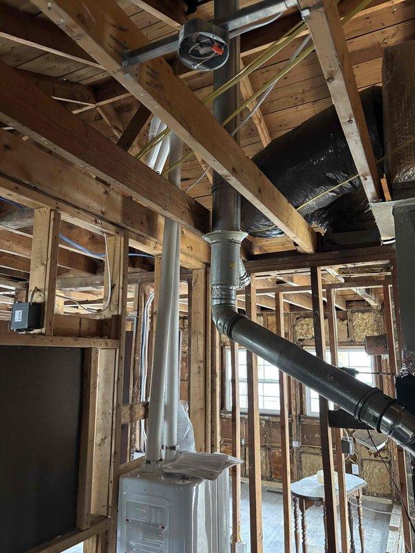 Completed follow-up service call for Job #403113675 to start up the HVAC system and install condensation pump as specified in previous visit. Inspected roof penetrations and verified proper sealing around vent pipes. System is now operational with condensation pump properly installed and connected to the main ductwork system.