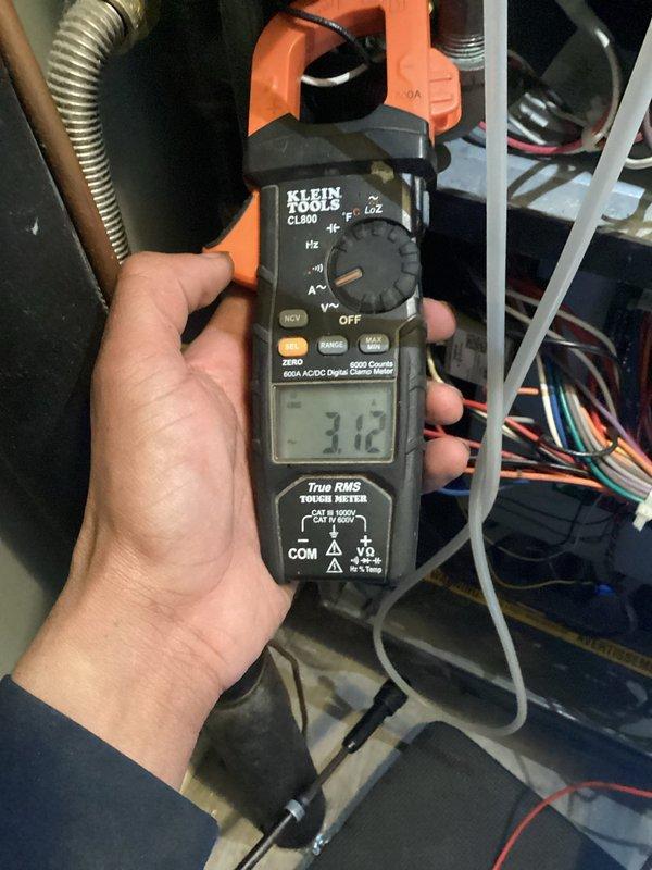 Performed scheduled annual maintenance on 8-year-old HVAC system with 16x25x5 filter. Conducted comprehensive electrical testing using Klein Tools CL800 clamp meter, measuring amp draw at 3.12 and inspecting all electrical connections. Verified proper operation of safety components including MET-SWITCH and examined wiring integrity throughout system.