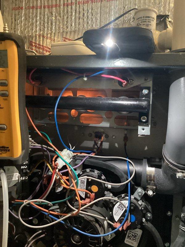 Performed scheduled annual maintenance on 8-year-old HVAC system with 16x25x5 filter. Conducted comprehensive electrical testing using Klein Tools CL800 clamp meter, measuring amp draw at 3.12 and inspecting all electrical connections. Verified proper operation of safety components including MET-SWITCH and examined wiring integrity throughout system.