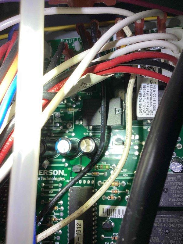 Diagnosed high limit switch fault on 7-year-old HVAC system displaying 4 red flash code. System was operational but unable to heat above 68°F despite thermostat setting of 72°F. Inspected control board connections and wiring harness, verified integrity of electrical components, and reset high limit switch. System now functioning properly with full temperature range capability.
