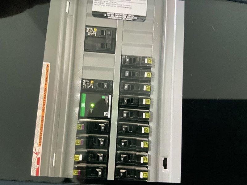 Completed site evaluation for potential mini-split expansion at residential property. Inspected existing mini-split system, electrical service panel capacity (noting operational breaker with indicator light), and exterior mechanical layout including two existing condenser units and backup generator. Assessment conducted to determine feasibility of adding additional head to current mini-split versus installing separate system.