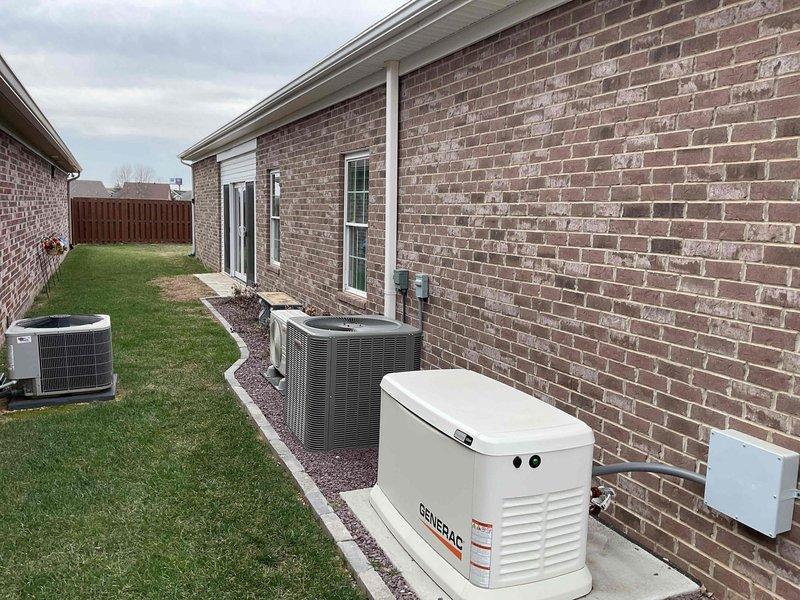 Completed site evaluation for potential mini-split expansion at residential property. Inspected existing mini-split system, electrical service panel capacity (noting operational breaker with indicator light), and exterior mechanical layout including two existing condenser units and backup generator. Assessment conducted to determine feasibility of adding additional head to current mini-split versus installing separate system.