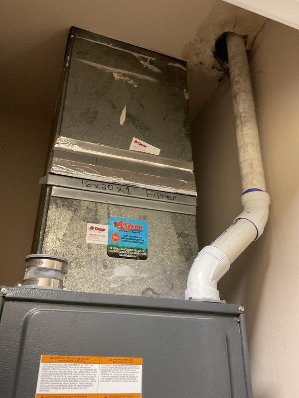 Responded to service call for water leak in HVAC system. Identified condensate drain issue where PVC pipe exits unit and penetrates roof. Inspected electrical components and circuit board connections. Repaired damaged PVC condensation line, properly sealed wall penetration, and verified proper drainage to prevent future leaks. System operational and functioning normally after service.