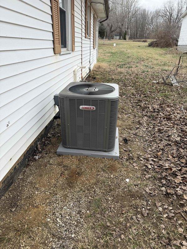 Installed a complete 2.5-ton Lennox HVAC system with 14 SEER condenser unit and 97% efficiency furnace. System includes properly connected PVC exhaust/intake venting and all necessary ductwork connections. Both indoor furnace unit and outdoor condenser were positioned and secured according to manufacturer specifications, with the outdoor unit mounted on a concrete pad adjacent to the residence.