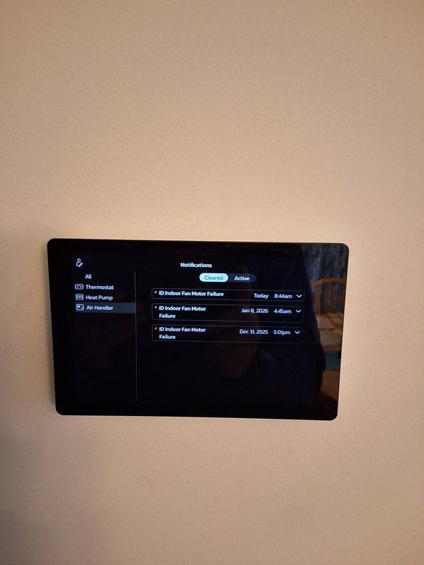Responded to service call for Lennox system displaying "Urgent service message" on thermostat. Diagnostic inspection revealed Indoor Fan Motor Failure alerts recorded on January 8, 2024, and December 31, 2023, though system was currently operating normally. Inspected and replaced air filter which showed signs of extended use, cleared error codes from thermostat, and verified proper system operation before concluding service.