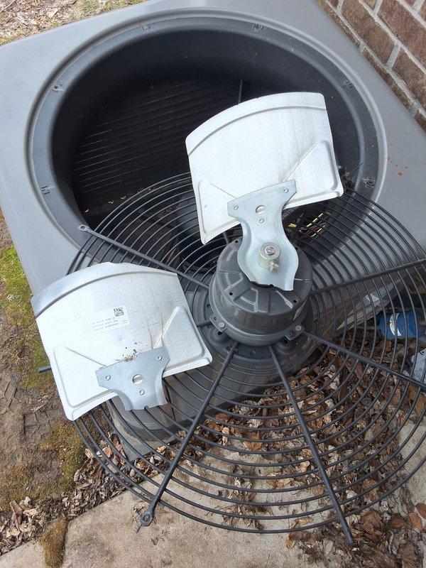 Responded to service call for a 5-year-old heat pump system that was reported to be shaking violently and producing excessive noise during operation. Upon inspection, found the outdoor condenser unit had accumulated debris in the fan assembly. Shut down the heat pump, cleaned the fan components, and verified proper operation after service. Customer had been relying on auxiliary heat strips while the heat pump was disabled.