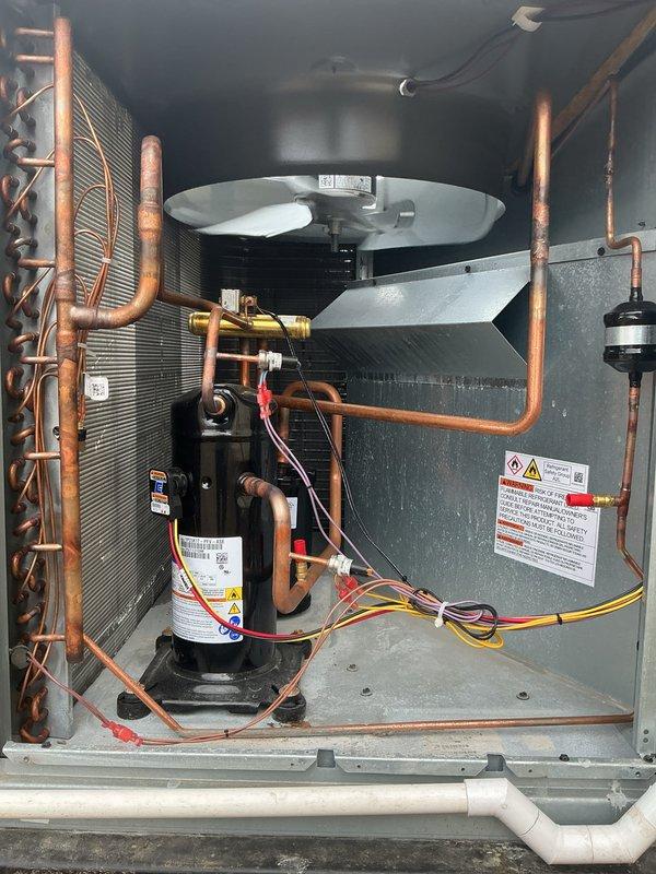 Performed annual Platinum Level maintenance on Daikin HVAC system (installed 11/28/25). Inspected control board circuitry and connections, verified proper operation of compressor unit, and examined refrigerant lines and evaporator coil assembly for optimal performance. System is functioning properly with all components in working condition, though minor dust accumulation was noted and cleaned.