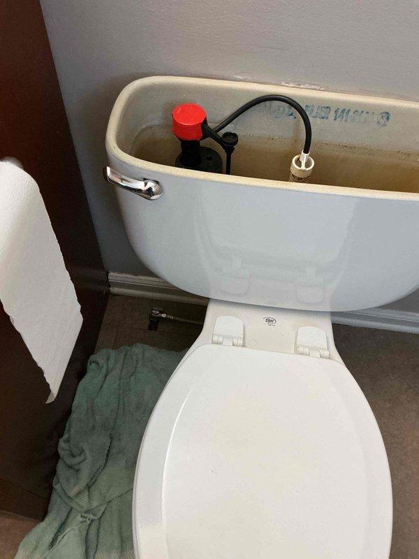 Replaced faulty water shutoff valve in toilet tank that was continuously running. Installed complete new flush kit, addressing mineral buildup and sediment accumulation in the tank. All components now functioning properly with proper water level restored.