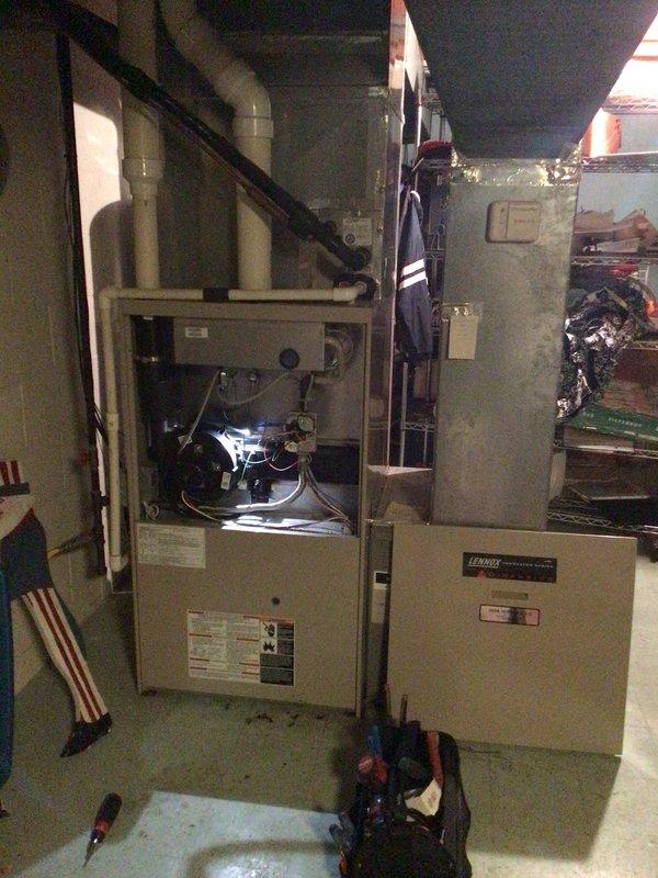 Responded to no-heat call for 15-year-old Lennox system (Model MNG32V5-125-1, Serial 5800B41474). Diagnosed faulty induction motor that was overheating and causing system shutdown; customer had correctly identified the issue as the motor was extremely hot to touch. Replaced motor and verified proper system operation with normal airflow through vents.