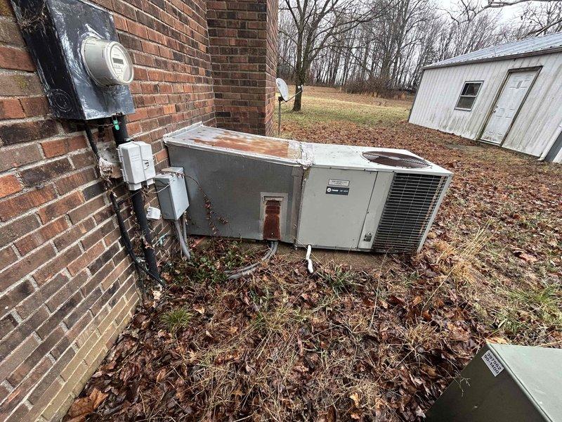 Performed comprehensive assessment of existing HVAC system, including inspection of aging Trane Weathertron analog thermostat and outdoor unit showing significant weathering with visible rust formation. Provided customer with replacement options for complete system upgrade, recommending high-efficiency equipment to replace the deteriorated outdoor condensing unit and modernize outdated control interface.