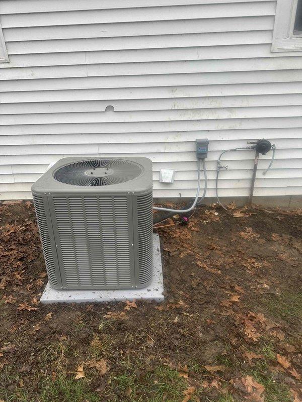Successfully completed installation of a GREEN 17 SEER 97% efficiency complete HVAC system, including a high-efficiency furnace with PVC venting in the basement utility area and an outdoor condensing unit mounted on a concrete pad with proper electrical connections. All ductwork was properly installed and insulated, with the system fully tested and operational.