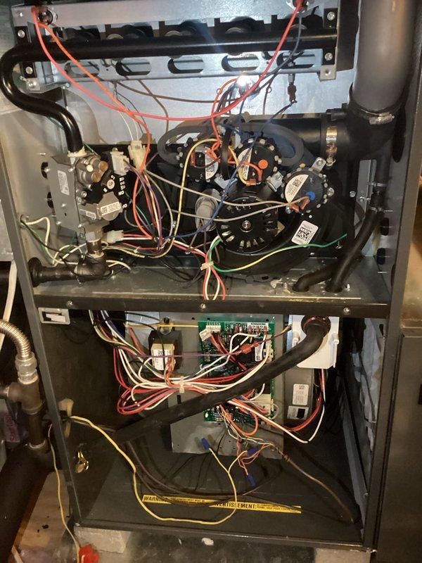 Performed routine AC tune-up maintenance on system of undetermined age. Conducted electrical diagnostics using Fieldpiece multimeter to verify proper voltage readings. Inspected internal wiring connections and blower motor assembly, confirming all components were functioning correctly with no issues identified.