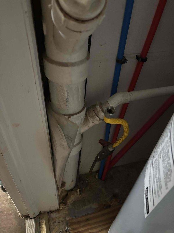 Performed ductwork modifications to accommodate plumbing installation. Inspected and documented installation of PVC drainage system with hot/cold water lines and condensate drainage. Verified proper connections and placement of supply lines within the utility access area, noting minor water staining that requires monitoring during follow-up visit.