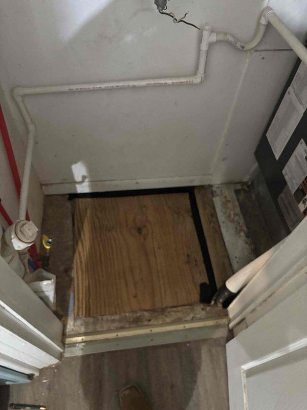 Performed ductwork modifications to accommodate plumbing installation. Inspected and documented installation of PVC drainage system with hot/cold water lines and condensate drainage. Verified proper connections and placement of supply lines within the utility access area, noting minor water staining that requires monitoring during follow-up visit.