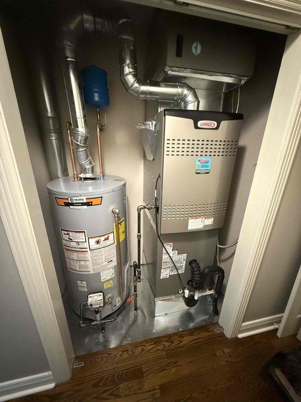Successfully installed a new 50-gallon short yellow gas water heater with proper venting and copper connections. Mounted a blue expansion tank to the wall and ensured all piping was correctly fitted. System was tested and verified to be functioning correctly with no leaks detected.