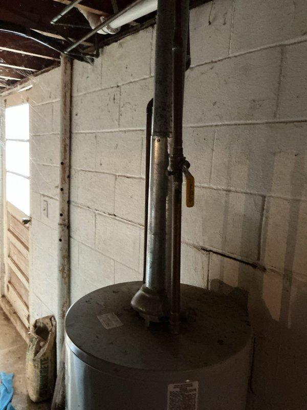 Diagnosed and replaced leaking 40-gallon gas water heater in basement mechanical room. Installed new unit with proper ventilation and connection to existing copper supply lines. Verified proper operation with no leaks at connection points and confirmed appropriate gas pressure and water temperature.