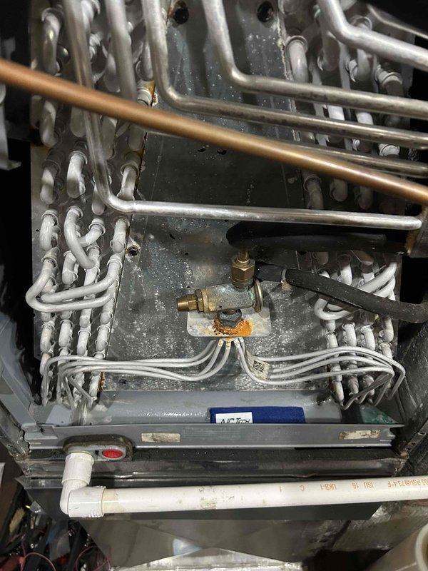 Performed Gold Level maintenance on 19-year-old HVAC system. Inspected evaporator coils showing signs of oxidation and minor corrosion at connection points, particularly at the brass valve fitting. Noted significant dust and debris accumulation in ductwork and on insulated pipes, recommending thorough cleaning before next scheduled maintenance in September 2025.