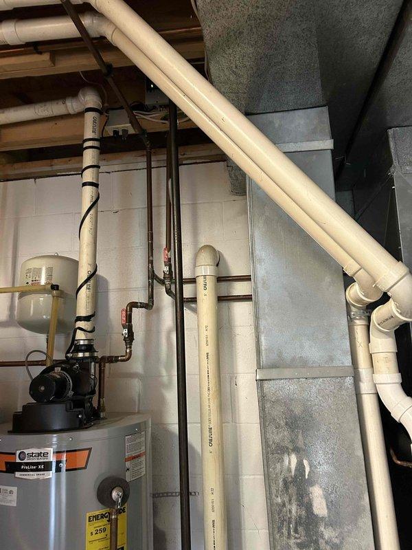 Conducted comprehensive assessment of existing basement HVAC system, including State ProLine XE water heater and primary furnace unit with PVC intake/exhaust configuration. Prepared detailed ductwork modification estimate to address airflow inefficiencies observed in the current installation, with recommendations for improved insulation on existing black flex ducts to enhance system performance and energy efficiency.
