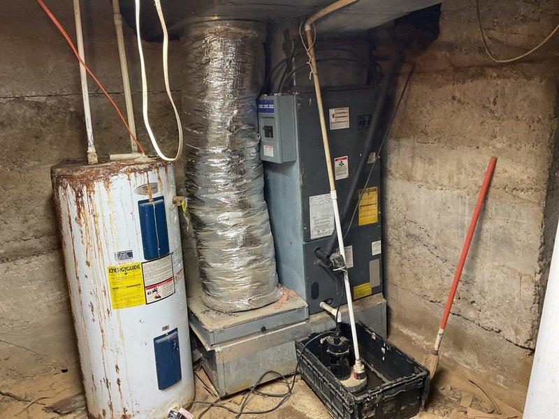 Completed comprehensive assessment for crawlspace system replacement, including evaluation of severely corroded water heater with visible rust staining and aging HVAC equipment. Documented condition of existing ductwork and outdoor condenser unit to prepare detailed quote for complete system replacement with new ductwork and complimentary tankless water heater installation per promotional offer.