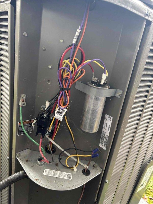Completed monthly platinum level maintenance on one HVAC system per CFI requirements. Inspected interior electrical components including capacitor, wiring connections, and circuit boards. Observed normal dust accumulation in unit housing and verified all colored wires (red, yellow, purple, black, green, white) were properly secured to their respective terminals with no signs of damage or overheating.